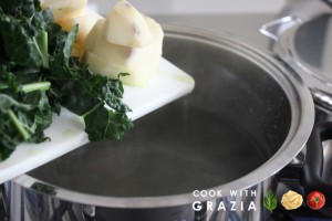 kale and potatoes into boiling water