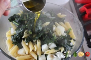 mix pasta and vegetables with evoo